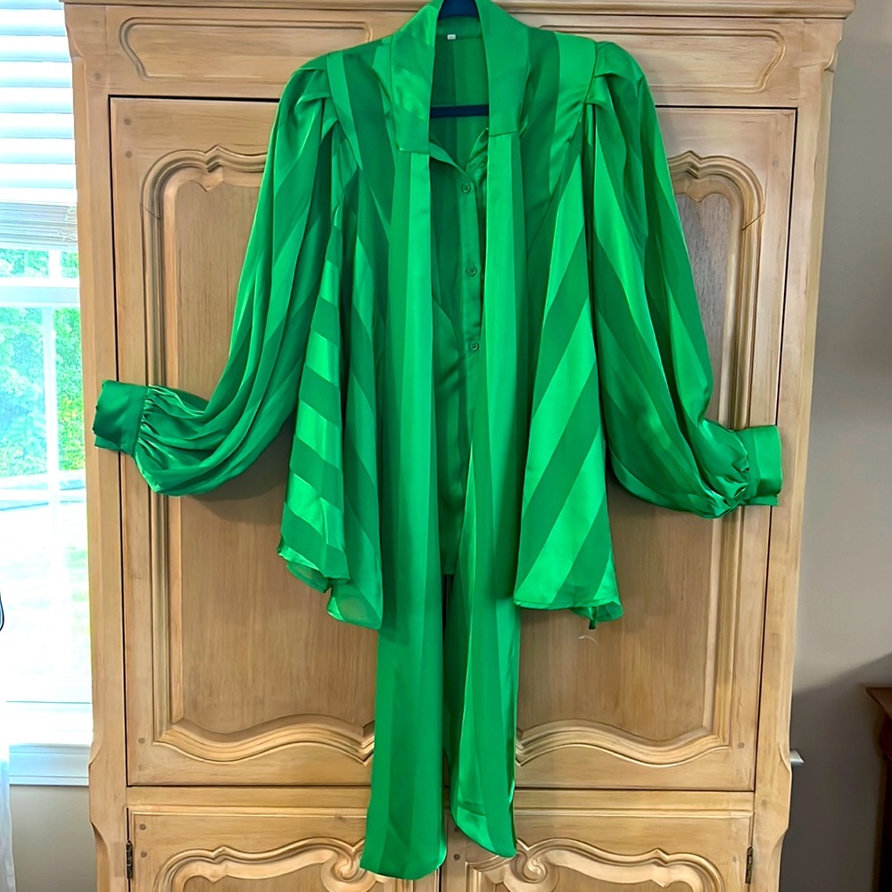 Loose green blouse.
